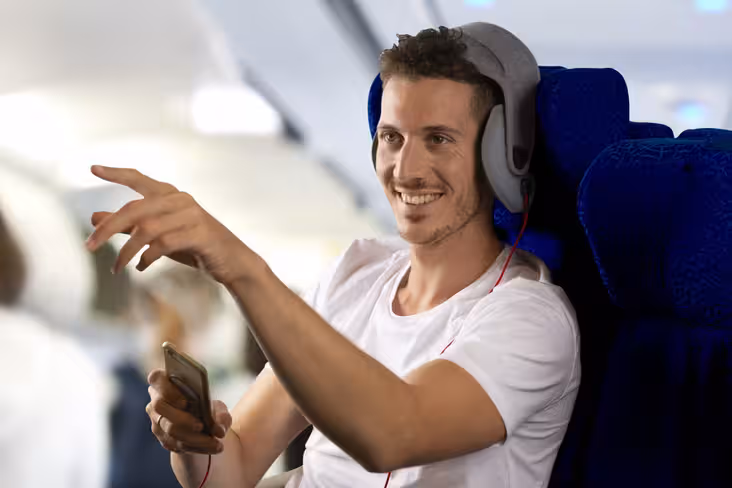 This gadget helps you sleep at 33,000ft by strapping your head to your seat